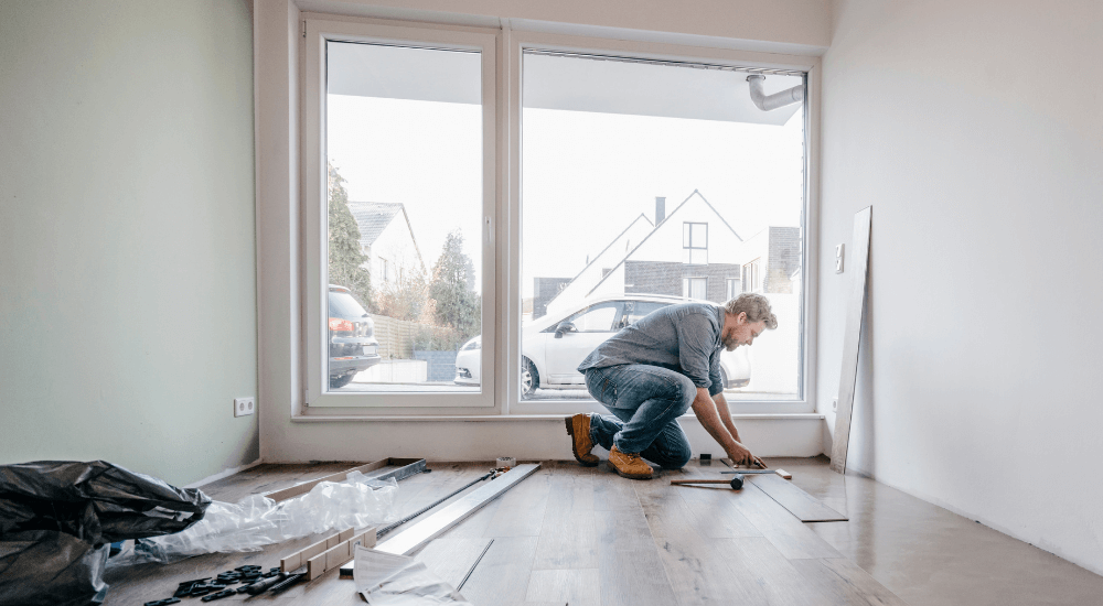 Restorer working on a wooden floor